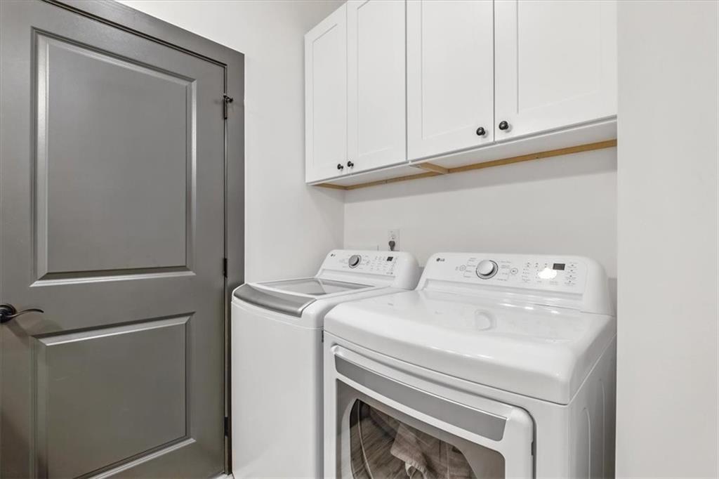 1379 Foxhound Trail Northeast Ranger, GA 30734 - Photo 23 of 42 a utility room with dryer and washer