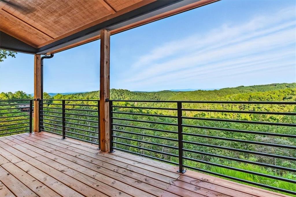 1379 Foxhound Trail Northeast Ranger, GA 30734 - Photo 36 of 42 a view of a wooden deck with a yard