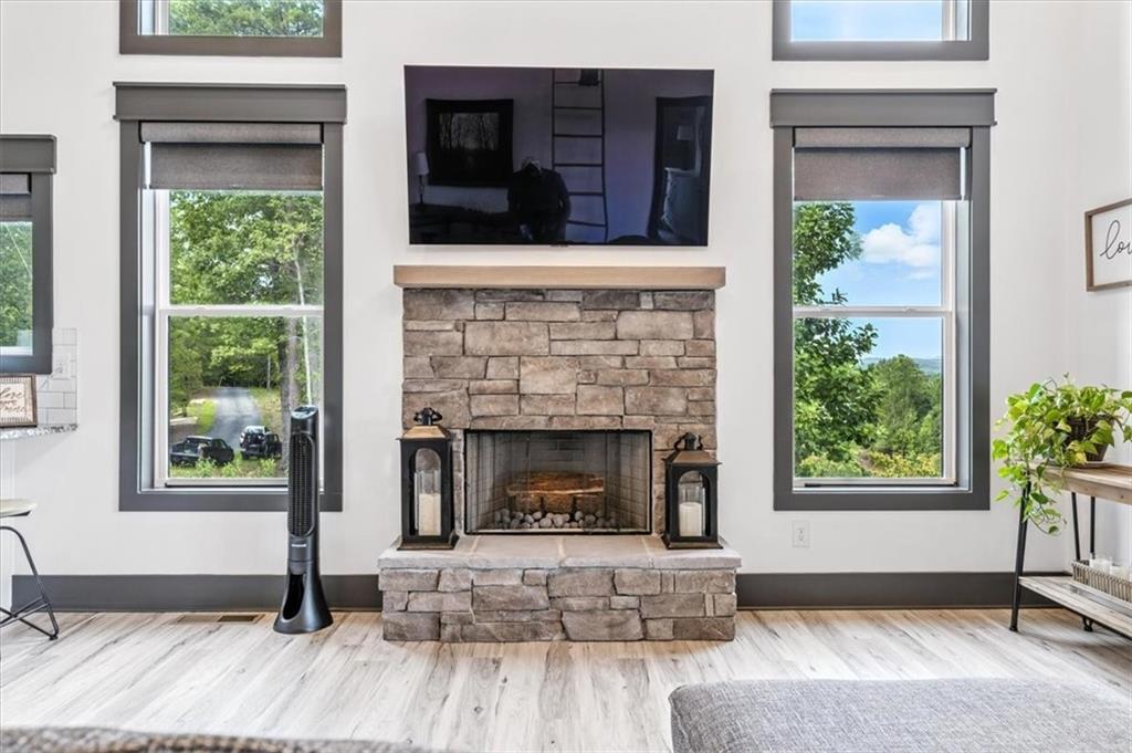 1379 Foxhound Trail Northeast Ranger, GA 30734 - Photo 9 of 42 a living room with furniture and a fireplace