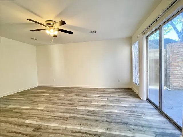 a view of a house with a large tree