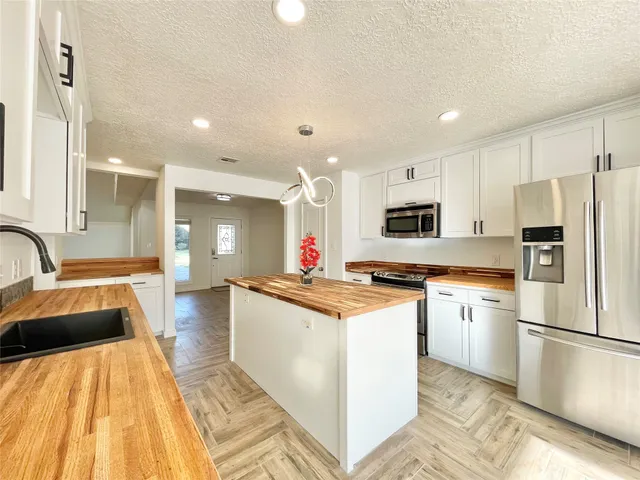 a backyard of a house with trees and stairs