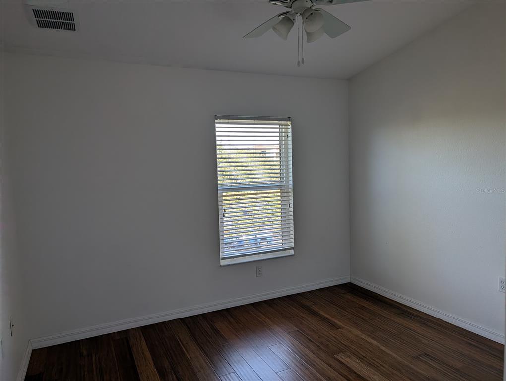 1200 Canopy Walk Lane, Unit 1235 Palm Coast, FL 32137 - Photo 14 of 37 an empty room with a window