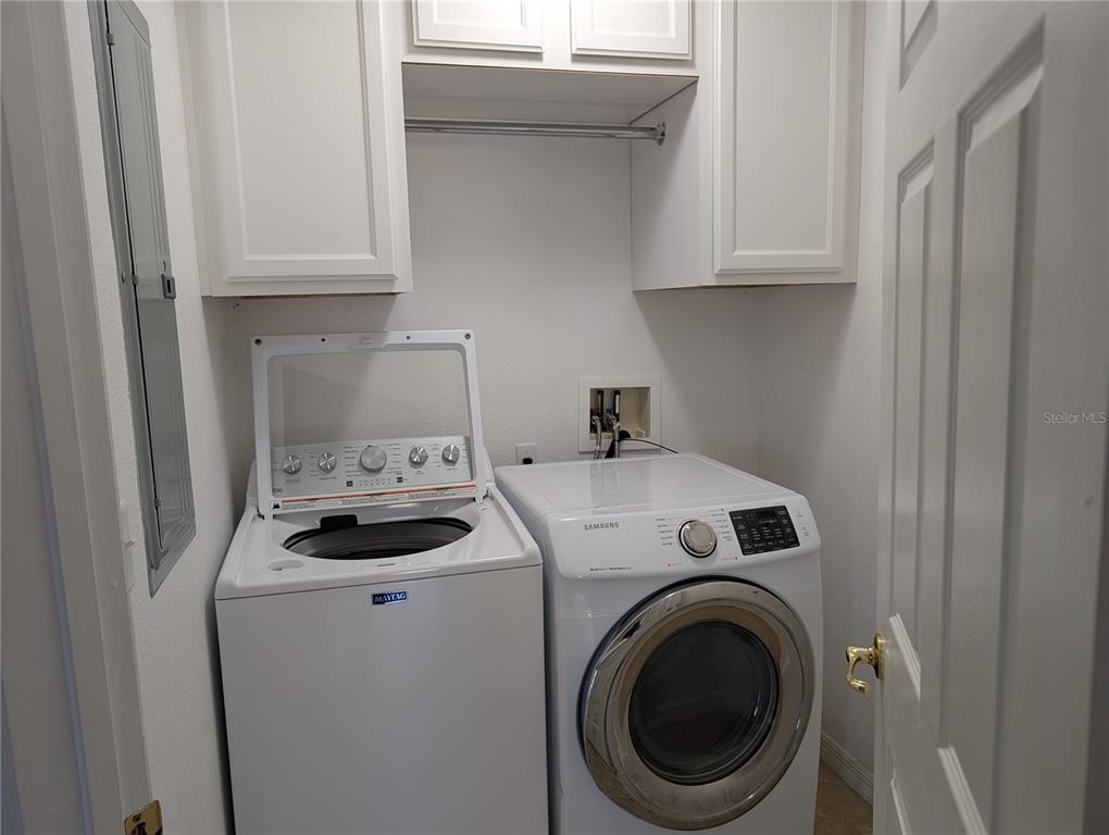 1200 Canopy Walk Lane, Unit 1235 Palm Coast, FL 32137 - Photo 15 of 37 a utility room with dryer and washer