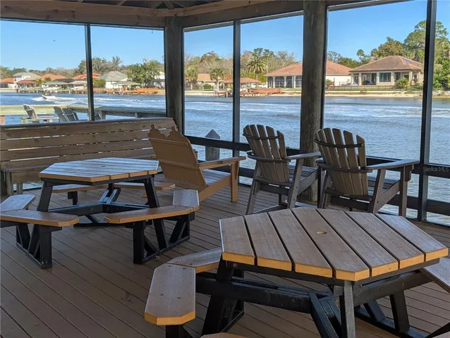 a sitting area with furniture on wooden deck