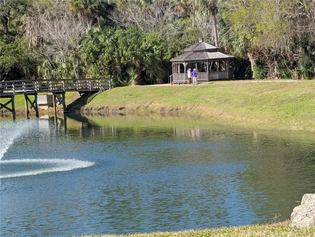 a view of a lake with a yard