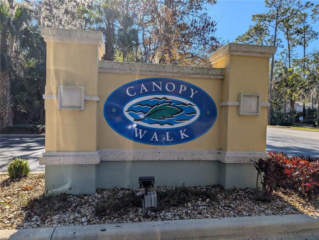 1200 Canopy Walk Lane, Unit 1235 Palm Coast, FL 32137 - Photo 36 of 37 a front view of a house with garden