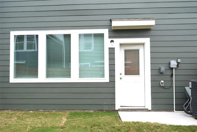 a view of front door and a window