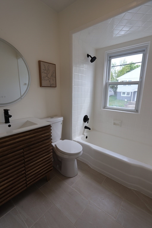331 Proctor Avenue Revere, MA 02151 - Photo 11 of 29 a bathroom with a toilet a sink and bathtub