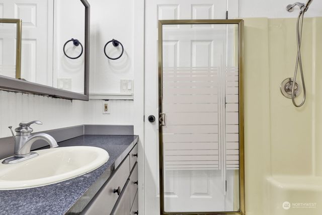 a bathroom with a sink and a mirror
