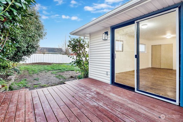 a view of a porch with wooden floor