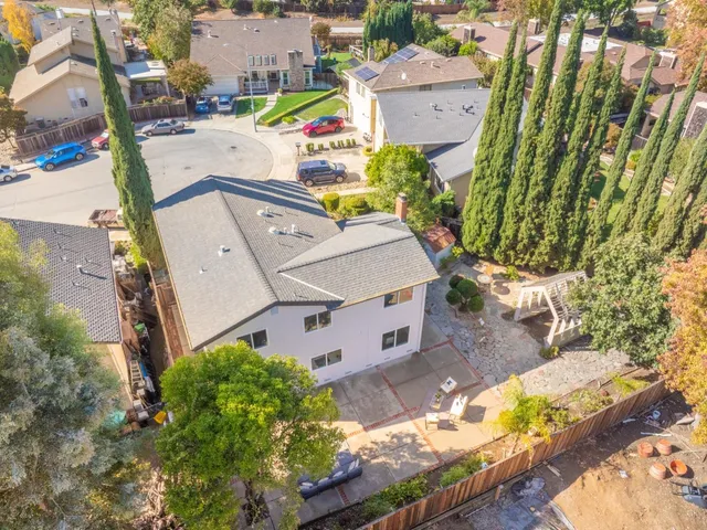 an aerial view of residential houses with outdoor space