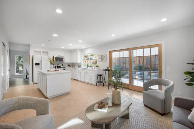 a kitchen with sink and white cabinets