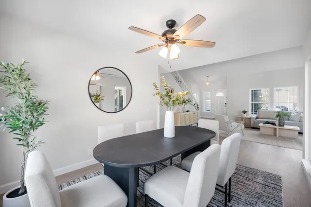 a bedroom with a bed a mirror and a window