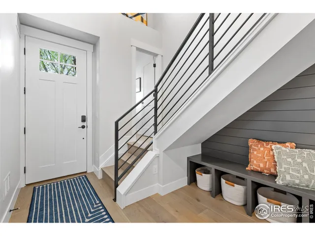 a view of an entryway with wooden floor