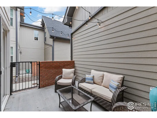 a view of backyard with a chair and table