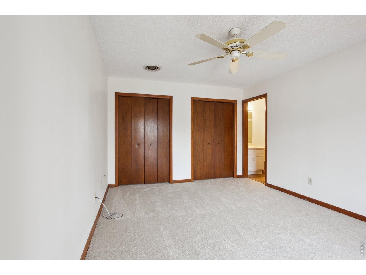 2651 9th Street Boulder, CO 80304 - Photo 12 of 25 a view of an empty room with a ceiling fan