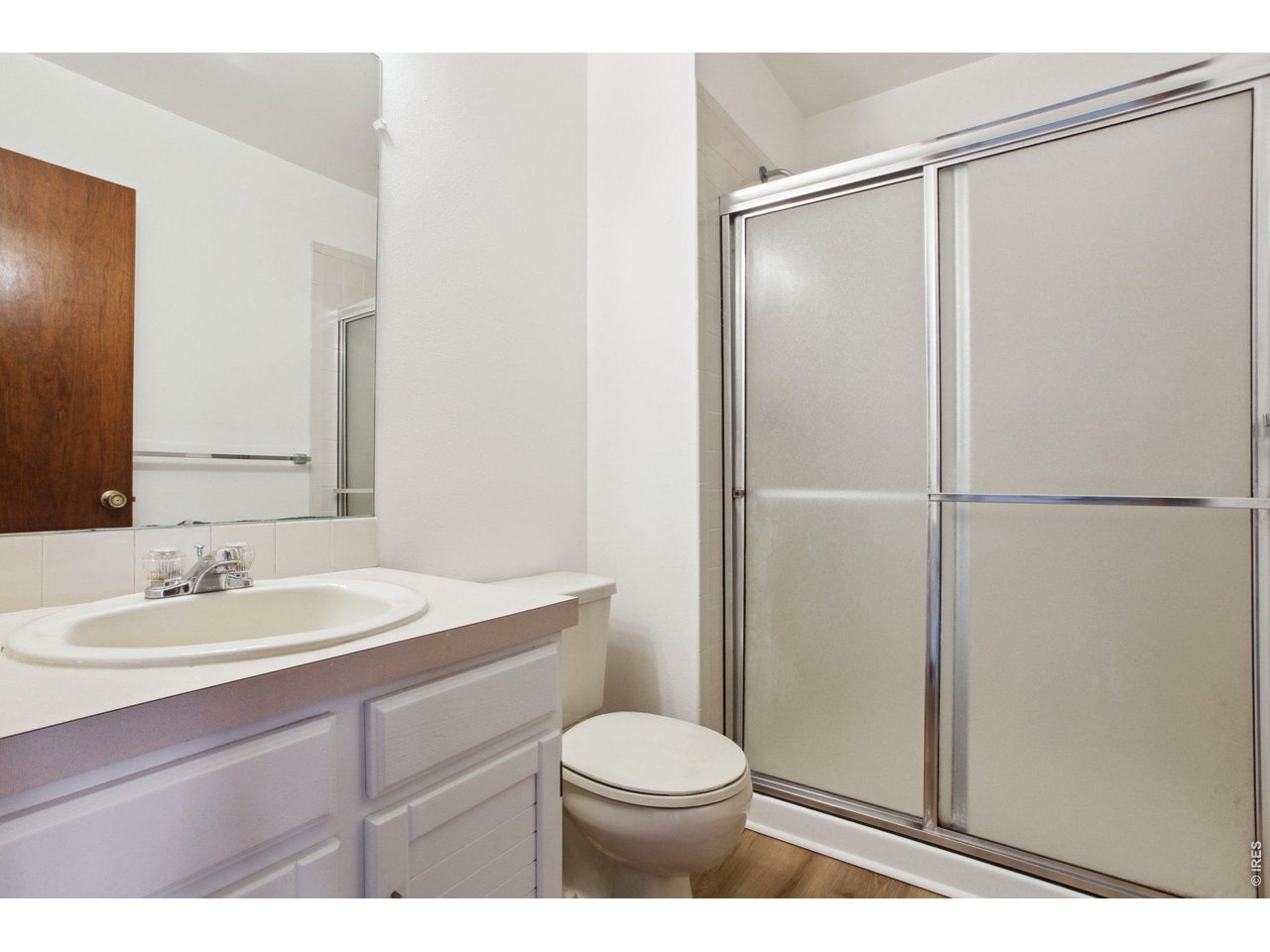 2651 9th Street Boulder, CO 80304 - Photo 13 of 25 a bathroom with a sink toilet and vanity