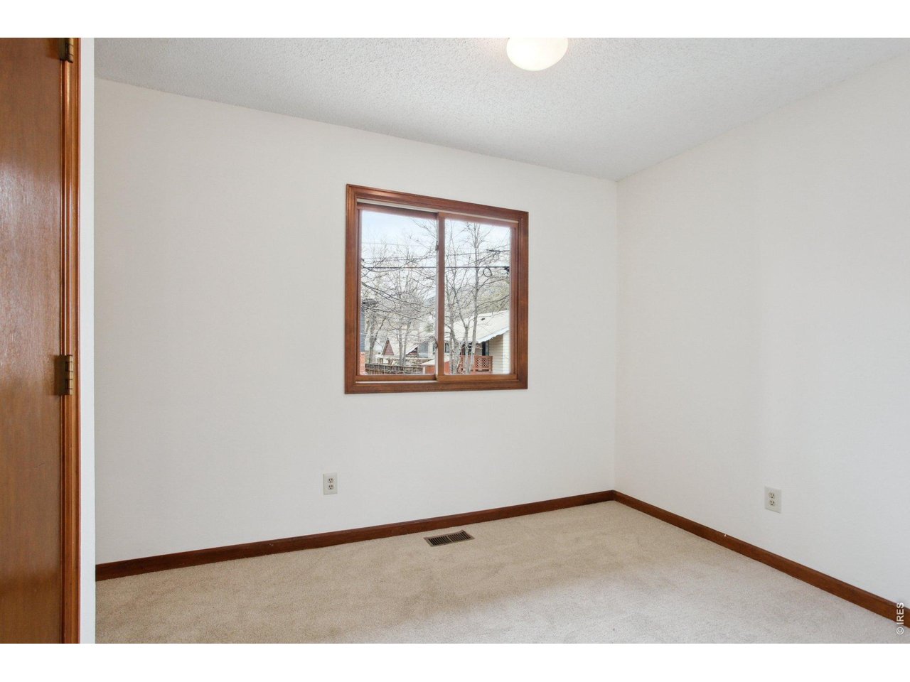 2651 9th Street Boulder, CO 80304 - Photo 7 of 25 a view of an empty room with a window
