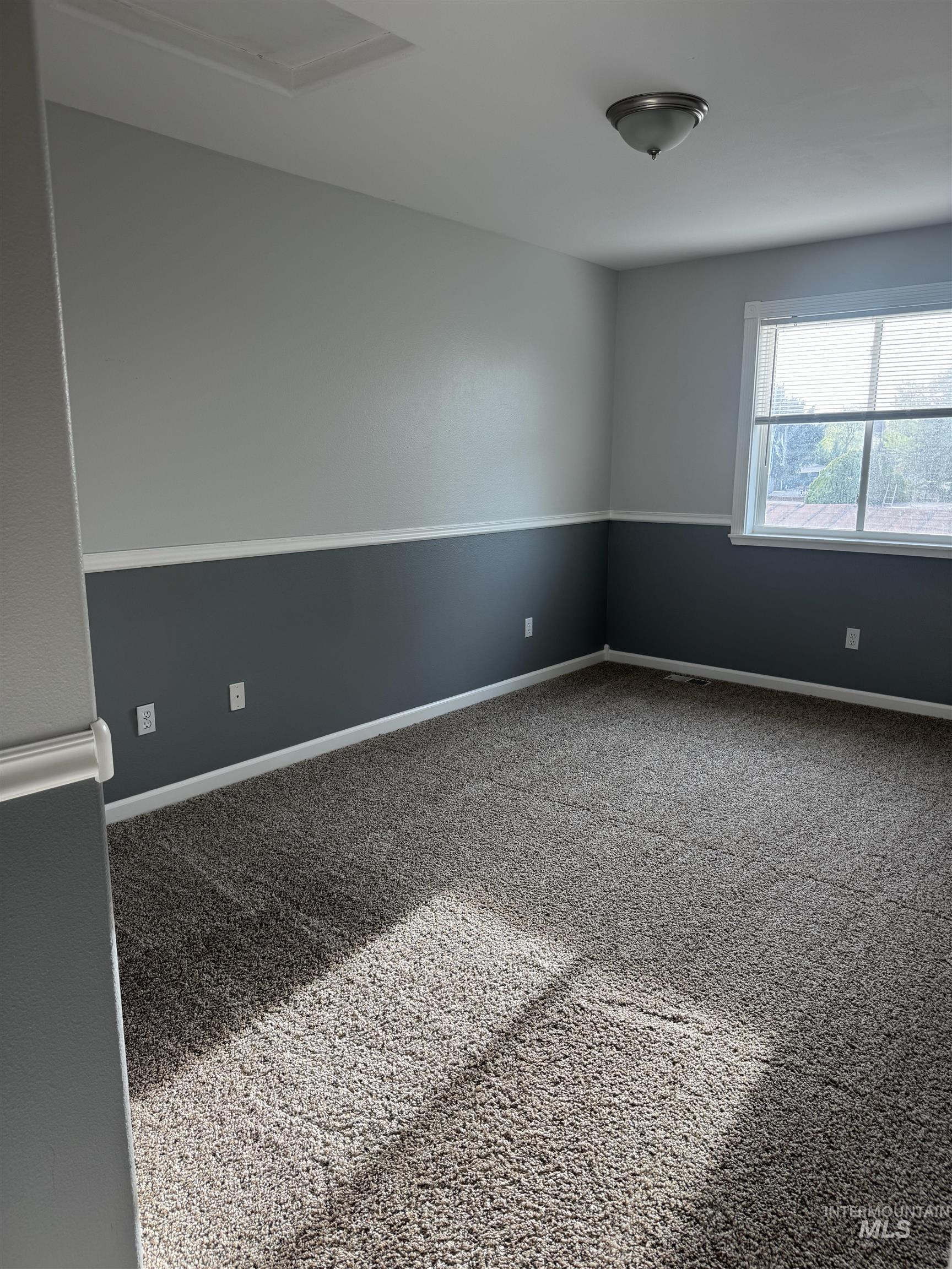 3203 South Capistrano Avenue Boise, ID 83705 - Photo 14 of 30 Carpeted spare room featuring baseboards