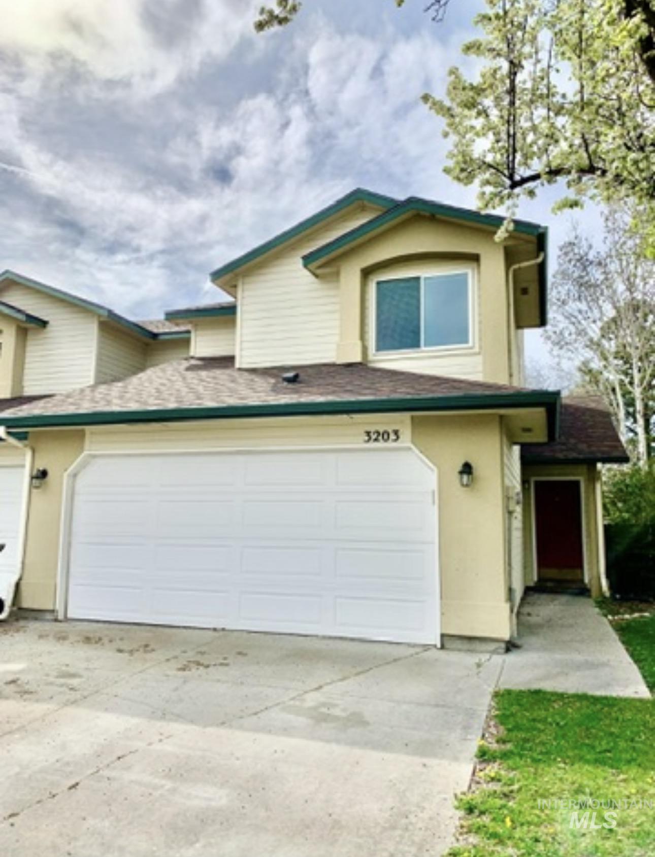 3203 South Capistrano Avenue Boise, ID 83705 - Photo 17 of 30 Traditional-style home with concrete driveway, a shingled roof, and stucco siding