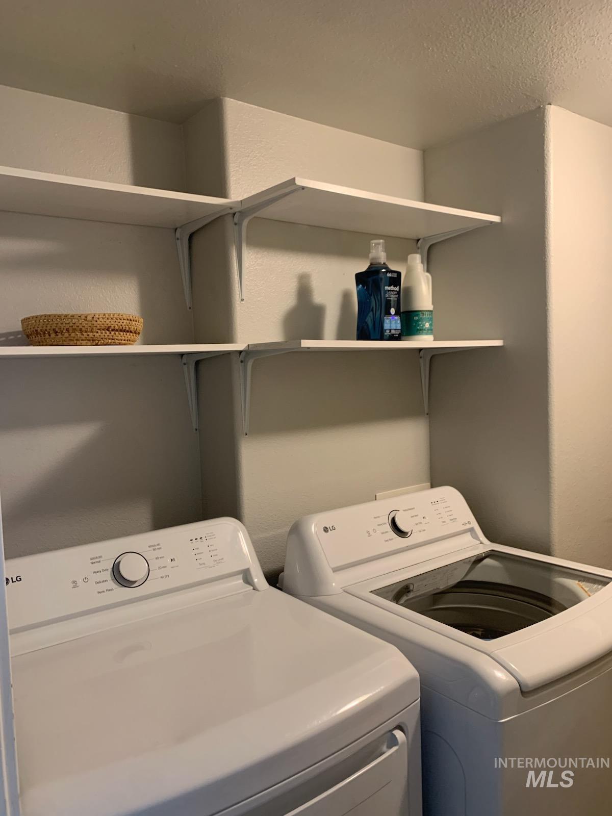 3203 South Capistrano Avenue Boise, ID 83705 - Photo 24 of 30 Laundry area with washer and clothes dryer and a textured ceiling