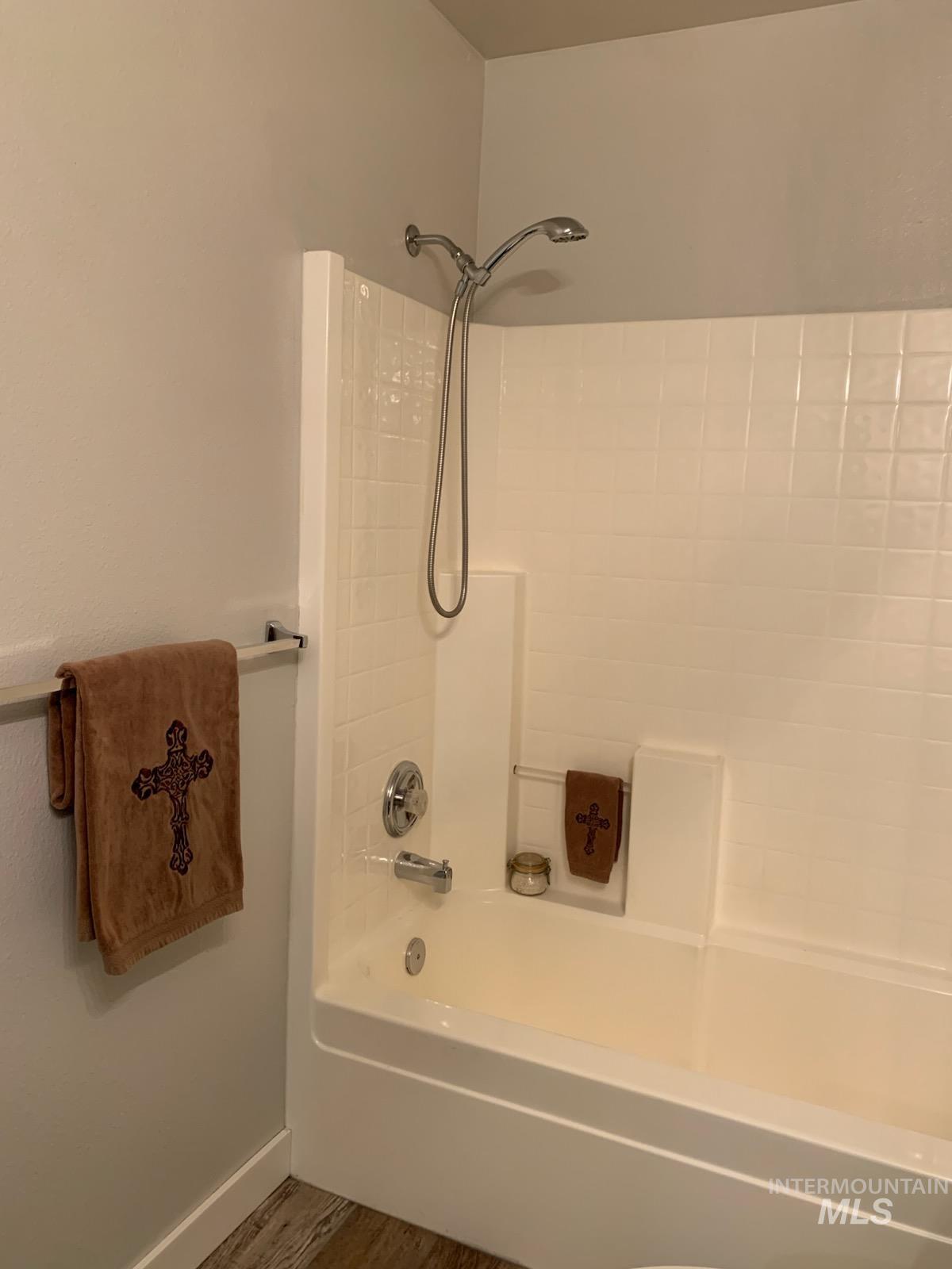 3203 South Capistrano Avenue Boise, ID 83705 - Photo 27 of 30 Bathroom featuring shower combination and wood finished floors