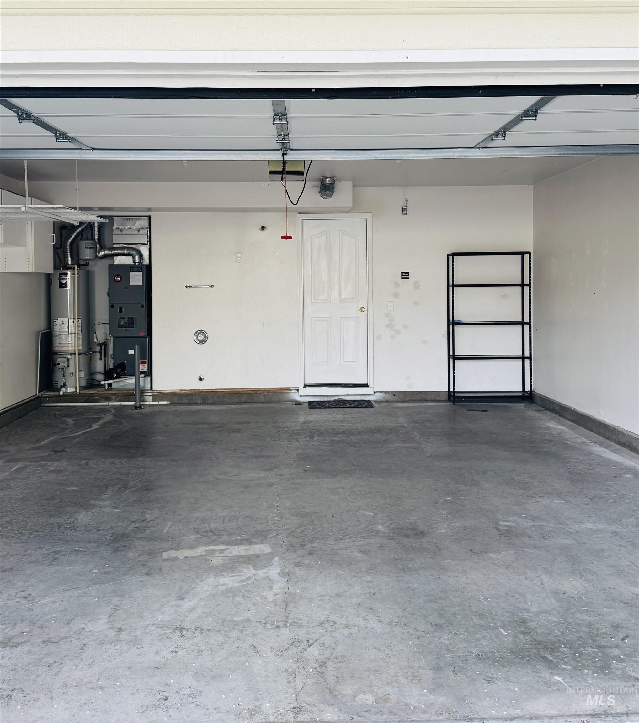 3203 South Capistrano Avenue Boise, ID 83705 - Photo 30 of 30 Garage with water heater and heating unit