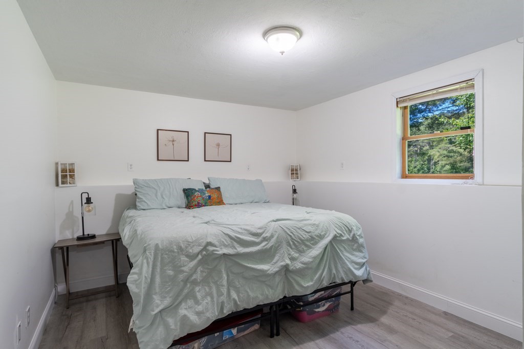 76 River Road Ware, MA 01082 - Photo 12 of 30 a bedroom with a bed and a window