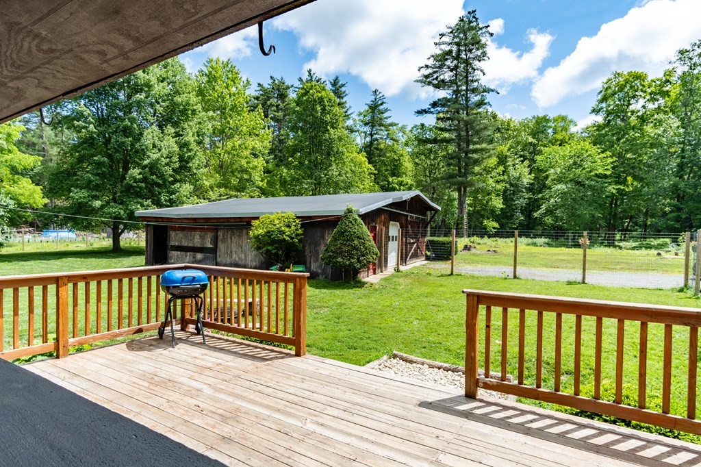 76 River Road Ware, MA 01082 - Photo 17 of 30 a view of a deck with a yard