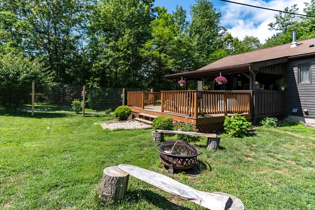 76 River Road Ware, MA 01082 - Photo 18 of 30 a backyard of a house with table and chairs