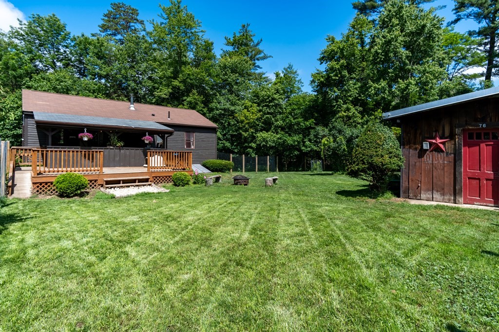 76 River Road Ware, MA 01082 - Photo 19 of 30 a view of a house with backyard and a tree
