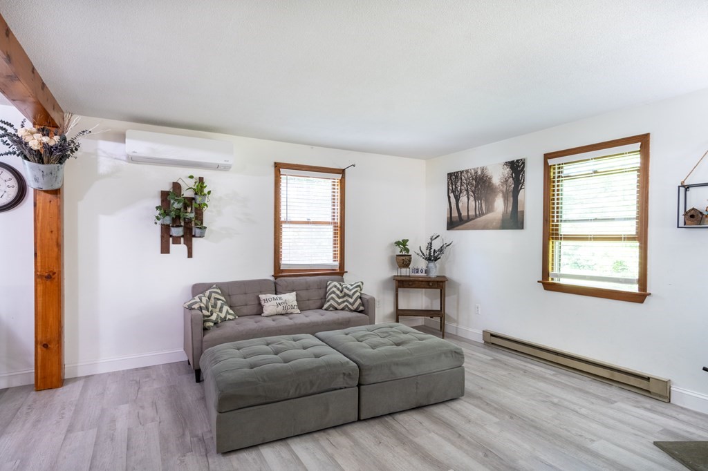 76 River Road Ware, MA 01082 - Photo 7 of 30 a bedroom with a bed lamps and window