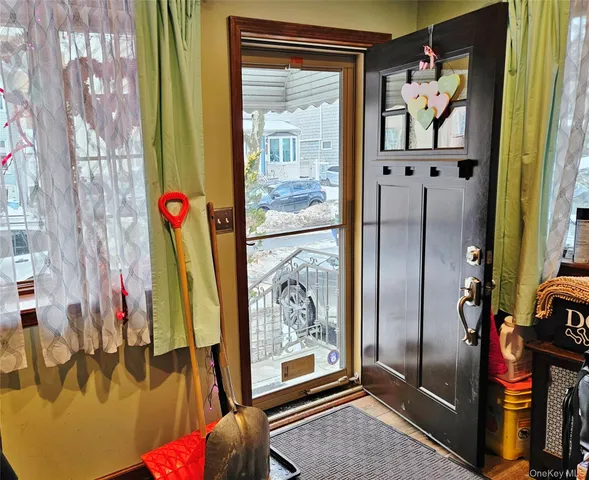 a very nice looking living room with furniture and a large window
