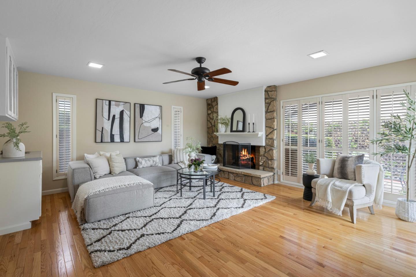 2356 Walden Square San Jose, CA 95124 - Photo 22 of 51 a living room with furniture a fireplace and a floor to ceiling window