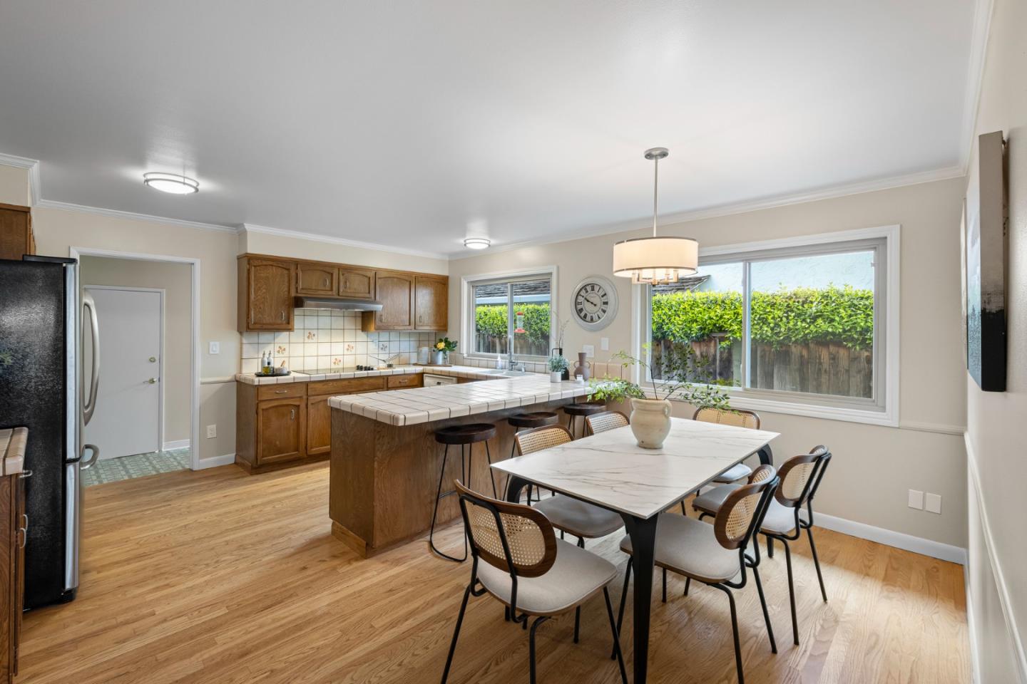 2356 Walden Square San Jose, CA 95124 - Photo 27 of 51 a kitchen with a dining table chairs and refrigerator