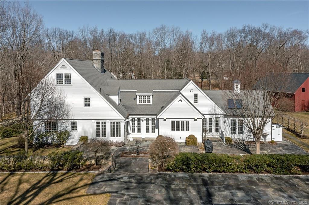 210 Skyline Ridge Road Bridgewater, CT 06752 - Photo 1 of 1 Back of home with terrace, pool and barn.