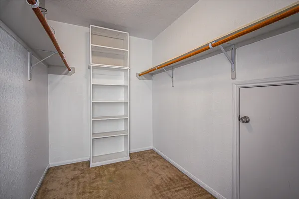 a view of an empty walk in closet