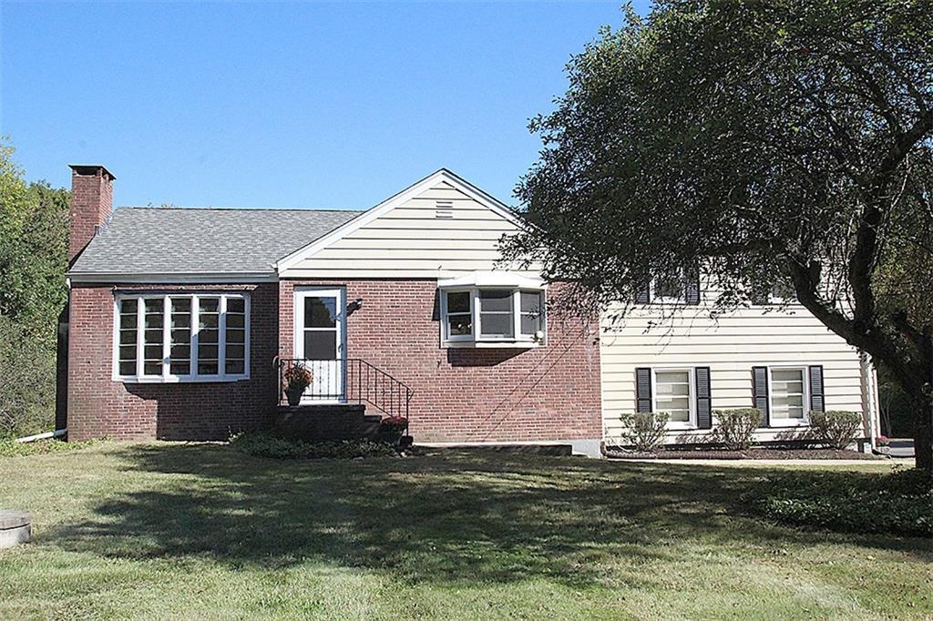 1189 Johnson Road Woodbridge, CT 06525 - Photo 1 of 1 a front view of a house with a garden