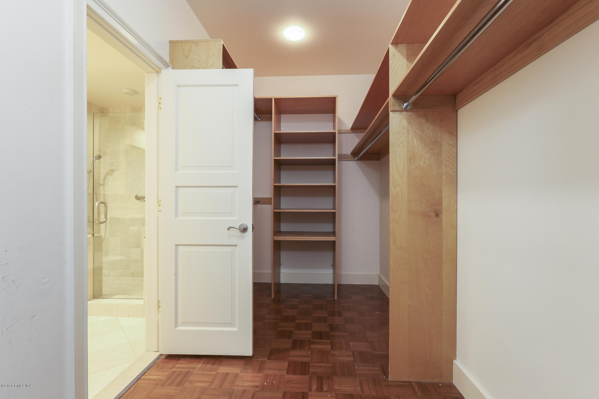 680 Steamboat Road, Unit 6 Greenwich, CT 06830 - Photo 18 of 40 a view of walk in closet with empty racks