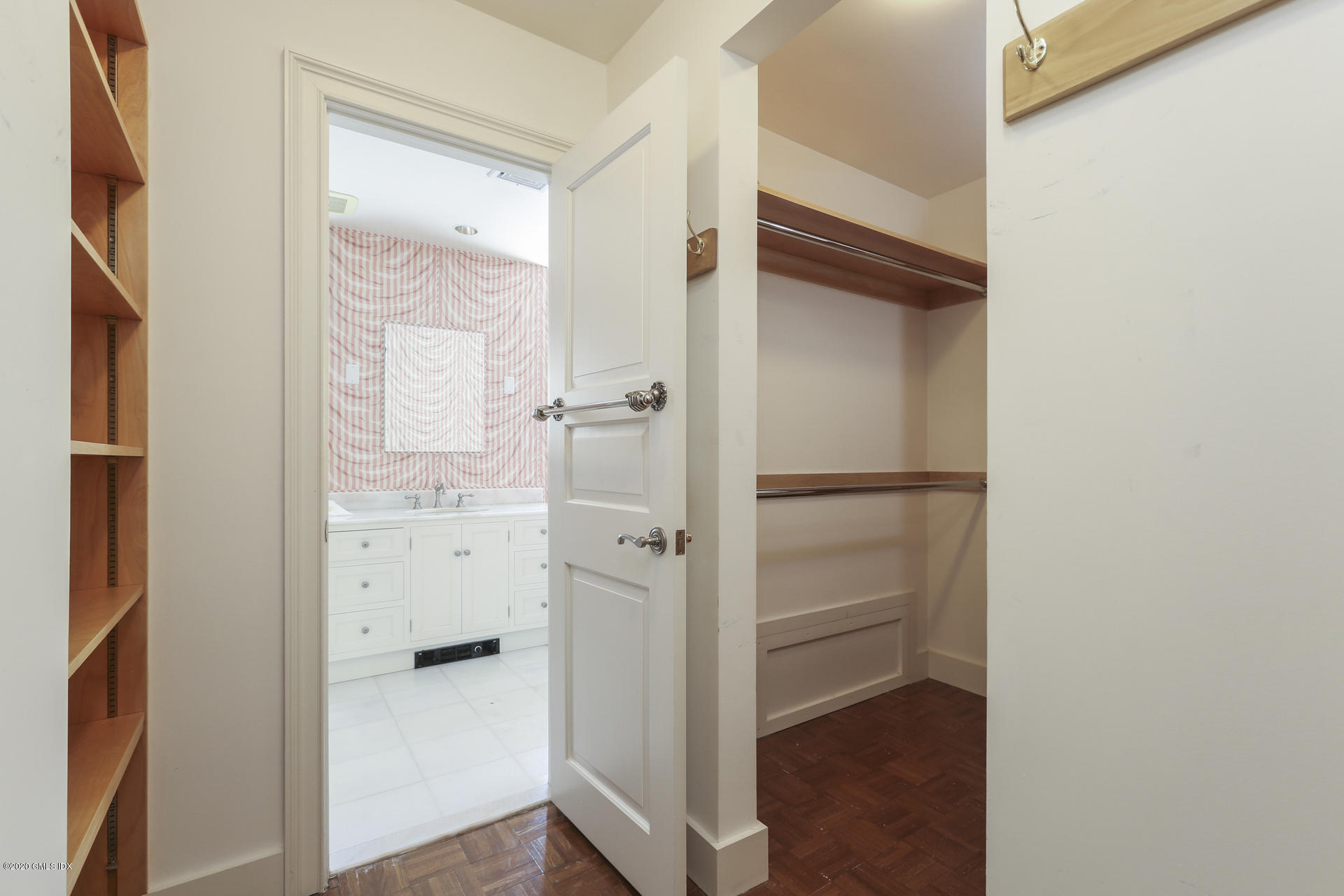 680 Steamboat Road, Unit 6 Greenwich, CT 06830 - Photo 19 of 40 a view of walk in closet with empty racks