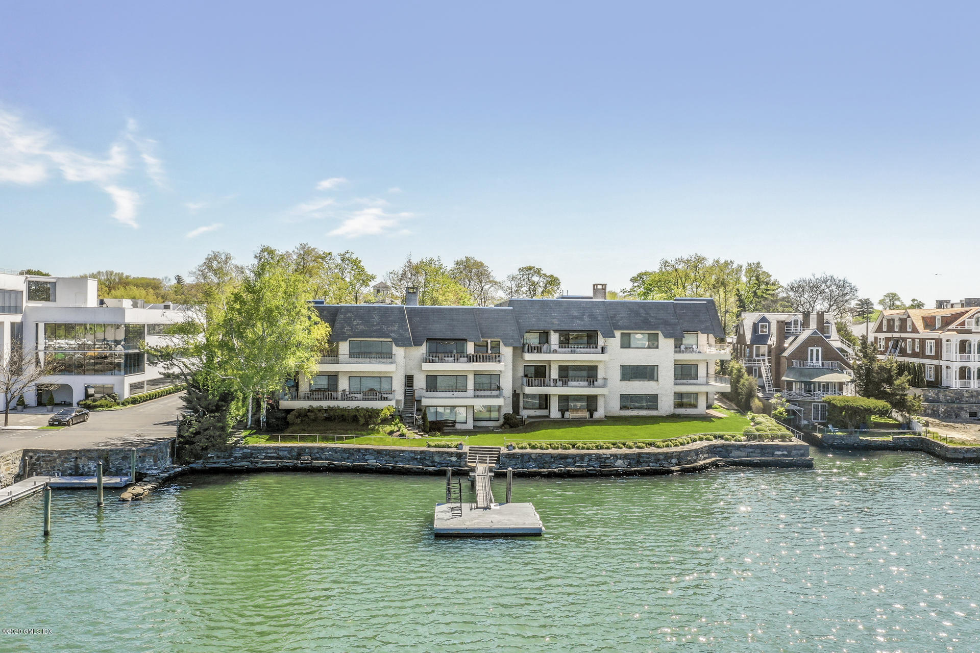 680 Steamboat Road, Unit 6 Greenwich, CT 06830 - Photo 2 of 40 a view of small house with swimming pool and lake view
