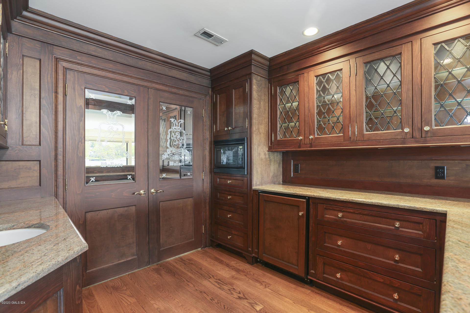 680 Steamboat Road, Unit 6 Greenwich, CT 06830 - Photo 23 of 40 a bedroom with a bed and a dresser