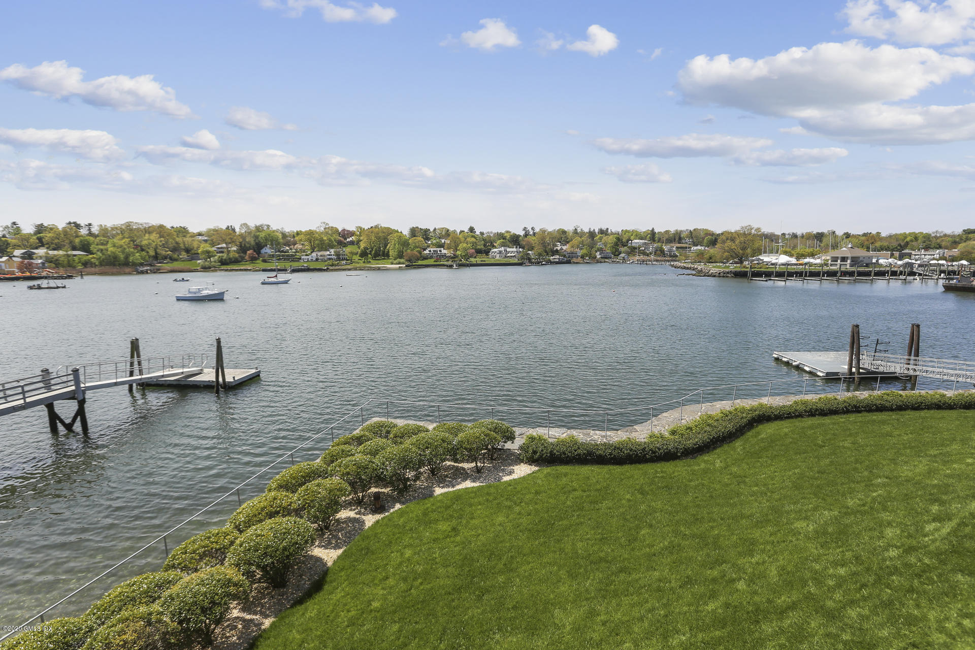 680 Steamboat Road, Unit 6 Greenwich, CT 06830 - Photo 33 of 40 a view of a lake with houses in the back