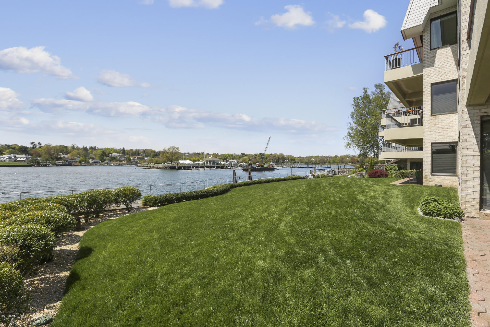 680 Steamboat Road, Unit 6 Greenwich, CT 06830 - Photo 34 of 40 a view of a lake with houses in the back