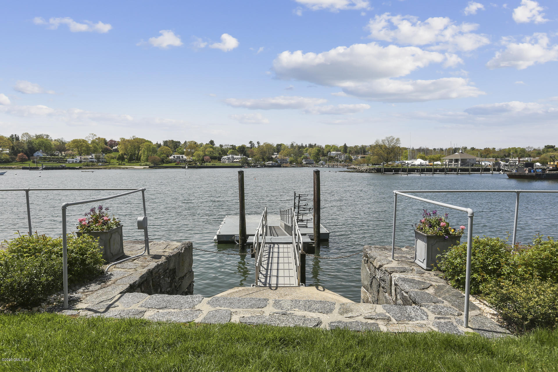 680 Steamboat Road, Unit 6 Greenwich, CT 06830 - Photo 35 of 40 a view of a lake with houses in front of field