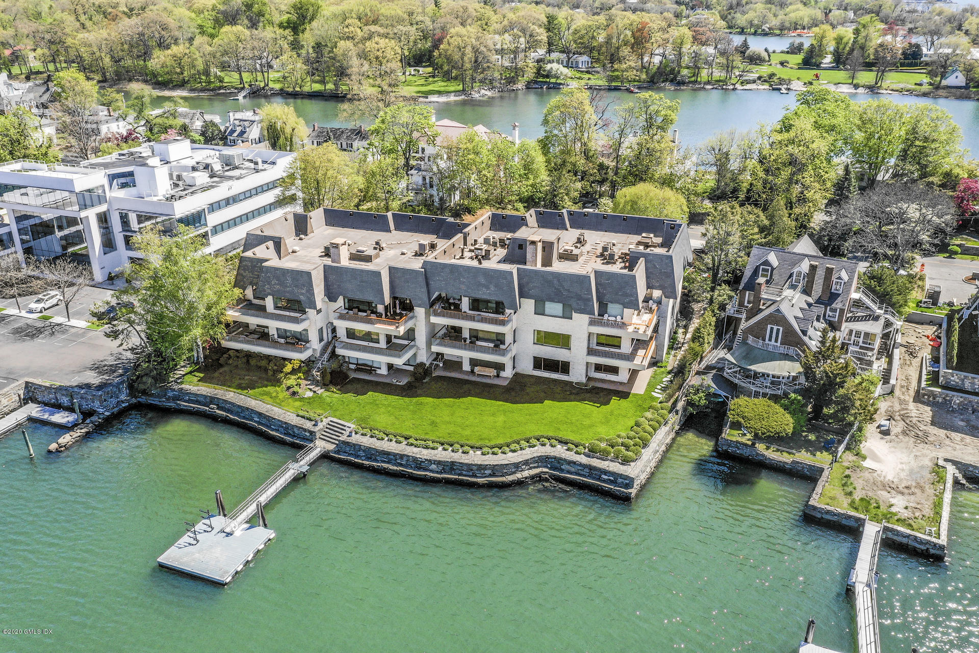 680 Steamboat Road, Unit 6 Greenwich, CT 06830 - Photo 38 of 40 an aerial view of a house with a garden and lake view