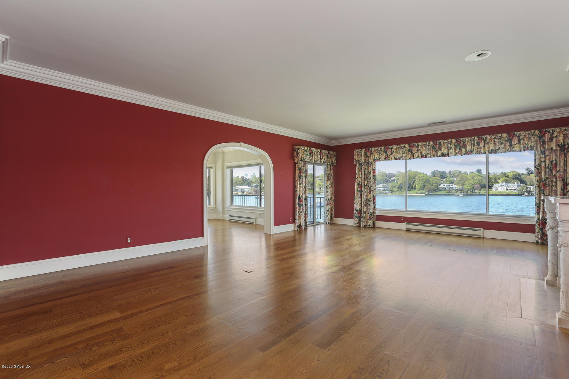 680 Steamboat Road, Unit 6 Greenwich, CT 06830 - Photo 7 of 40 a view of empty room with wooden floor and fan