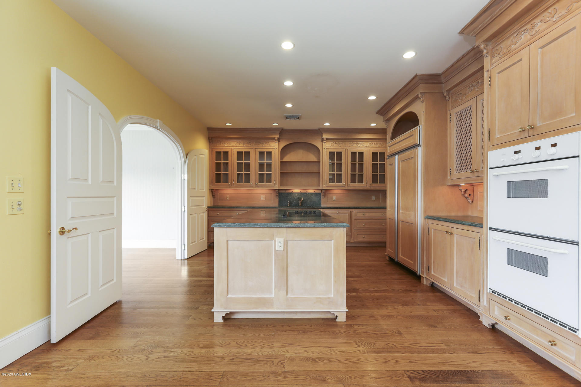 680 Steamboat Road, Unit 6 Greenwich, CT 06830 - Photo 10 of 40 a open kitchen with stainless steel appliances granite countertop a stove and a refrigerator