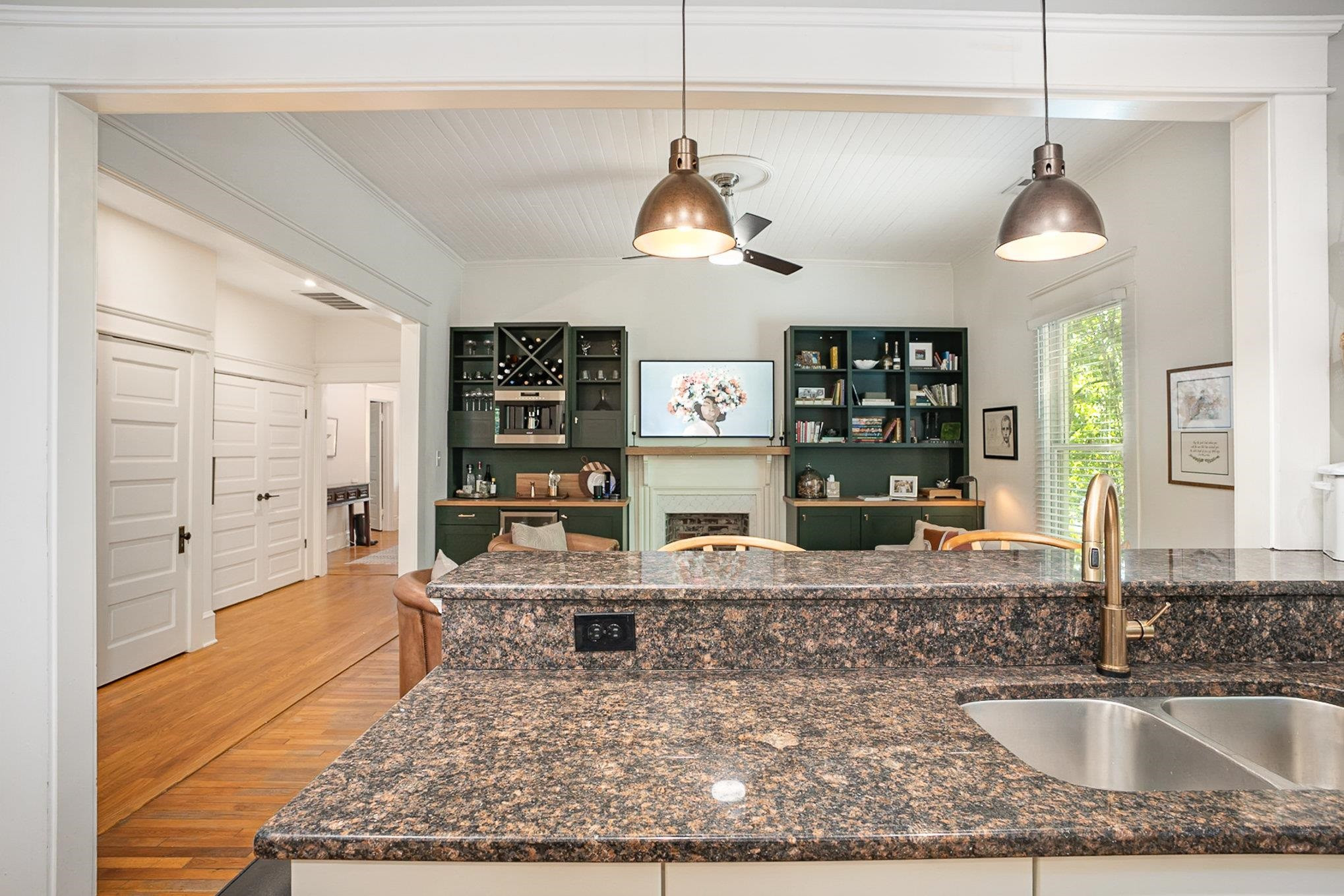 908 Burch Avenue Durham, NC 27701 - Photo 12 of 27 a room with lots of wooden furniture and a chandelier