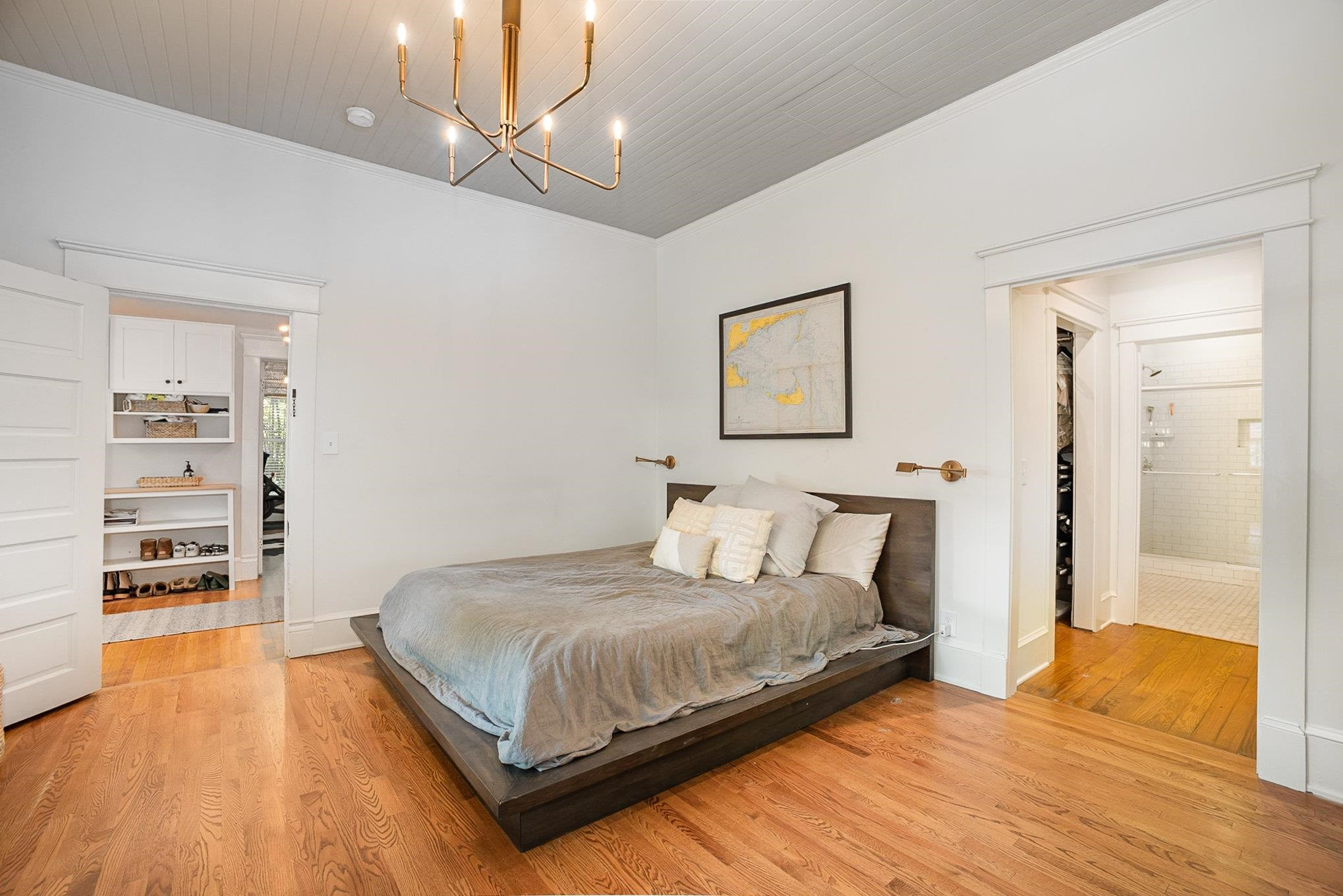 908 Burch Avenue Durham, NC 27701 - Photo 13 of 27 a bedroom with a bed and a book shelf